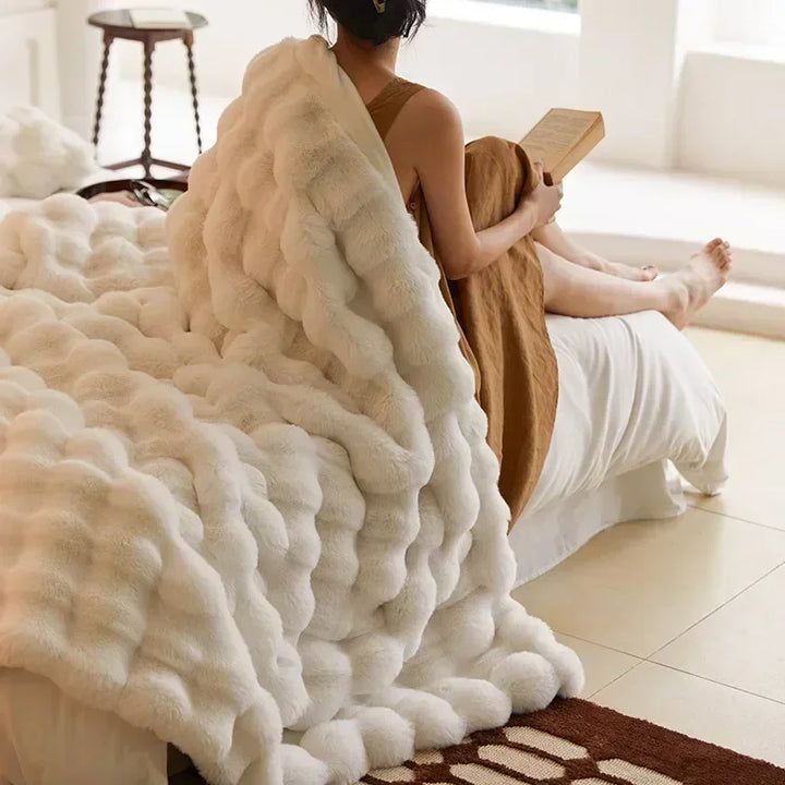 Luxurious faux fur throw blanket, incredibly soft and cozy for living room decor.