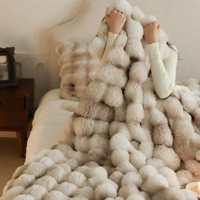 Plush, anti-pilling faux fur blanket in a rich, warm tone, perfect for any home.