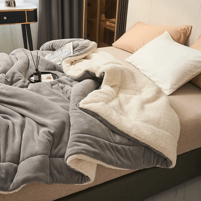 Cozy unisex fleece blanket, perfect for luxurious warmth in any bedroom. Soft, durable, easy care throw.