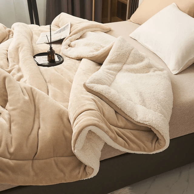 Indulge in luxury with this soft, warm fleece blanket. A plush, cozy throw for ultimate comfort at home.
