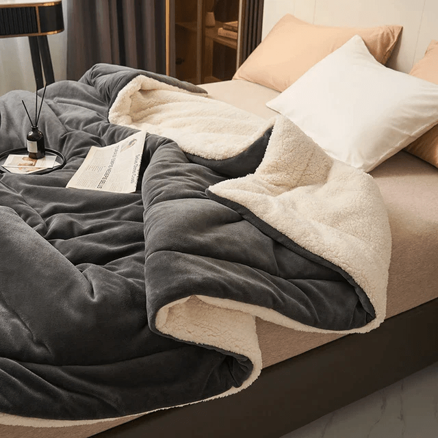 Experience ultimate warmth with this plush fleece blanket. Super soft, cozy throw for cold evenings.