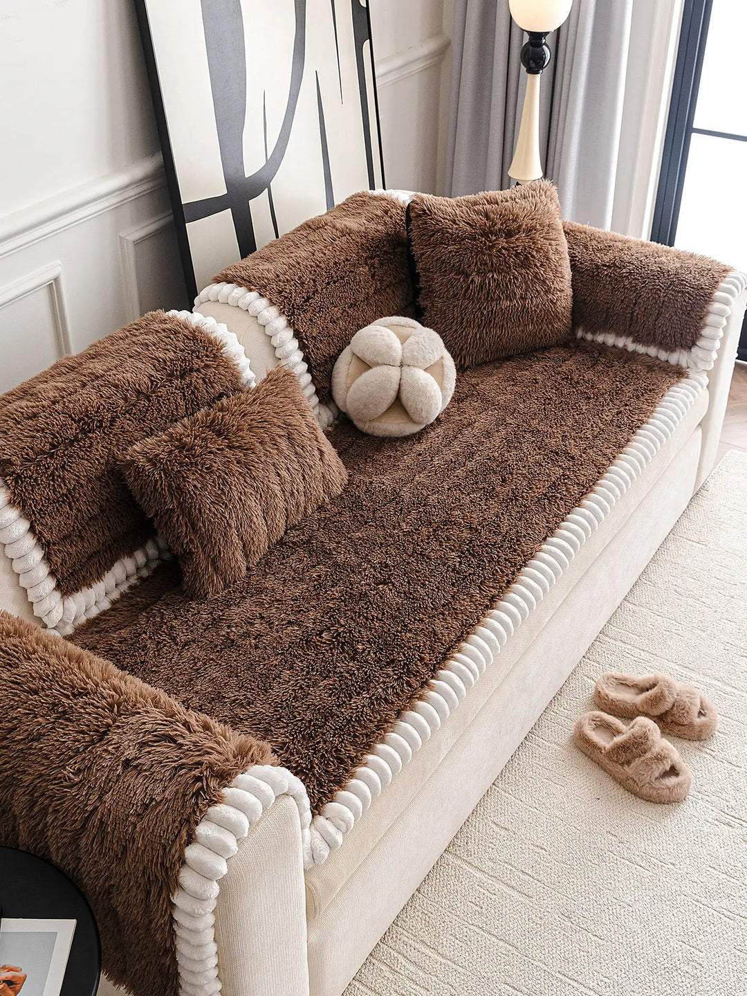 Side view of a sectional covered with a luxurious fluffy plush protector, highlighting its non-slip features.