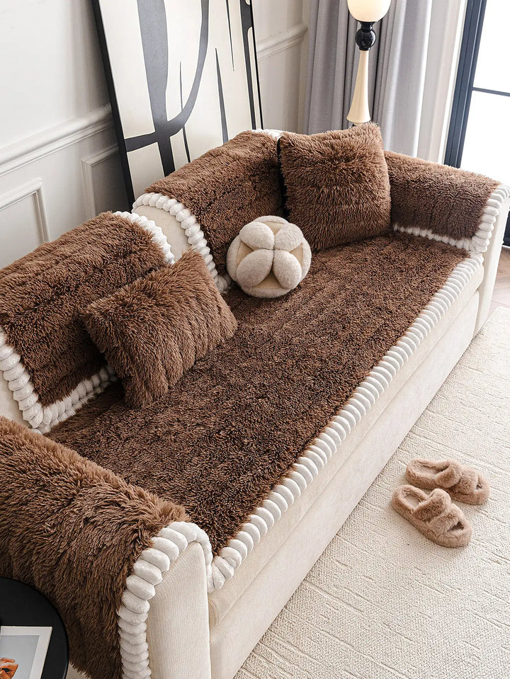 Side view of a sectional covered with a luxurious fluffy plush protector, highlighting its non-slip features.