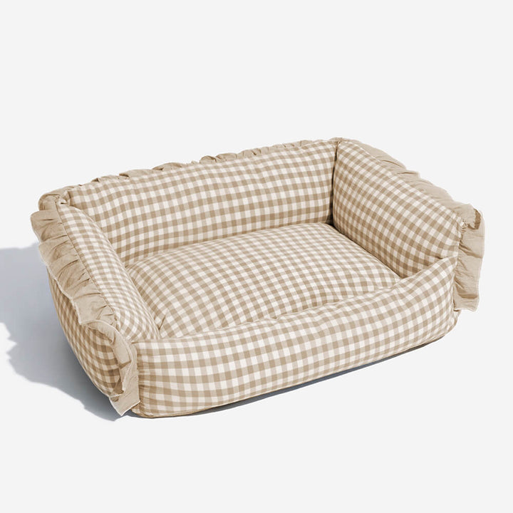 Stylish dog and cat bed, plaid design with ruffles, offering a comfortable retreat