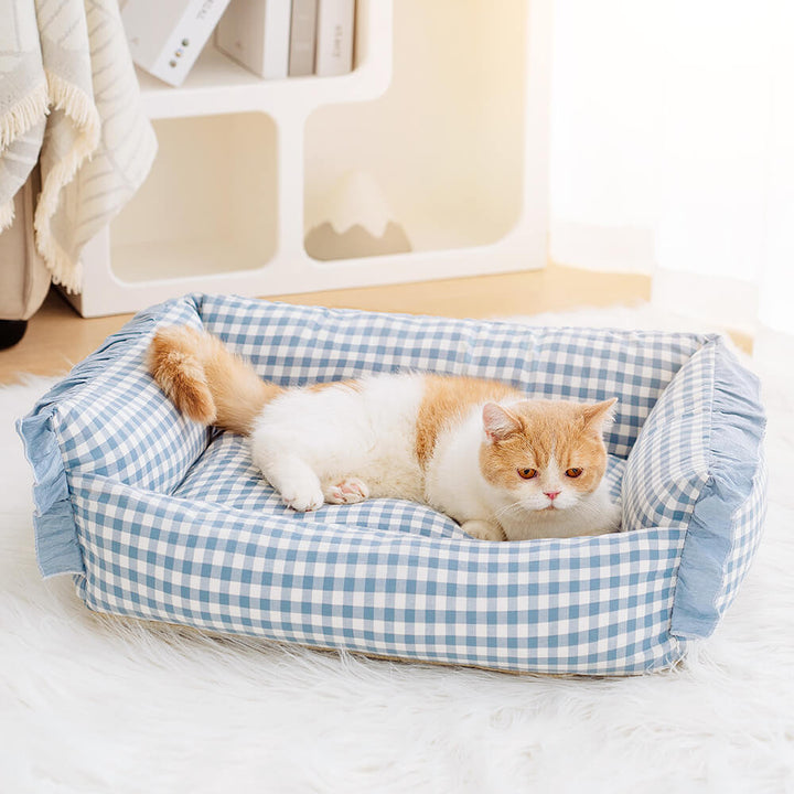 Unisex pet bed with removable cover, featuring a stylish plaid design and ruffled edge