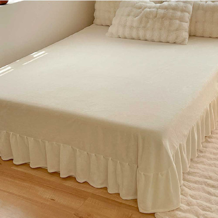 Plush faux fur duvet cover & sheet set in a neutral tone, cozy bedroom.