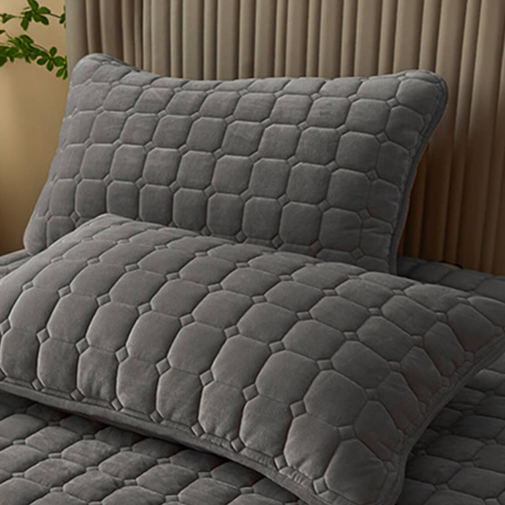 Elegant white plush velvet fitted sheet with pillowcases, offering breathable comfort for any bed size.