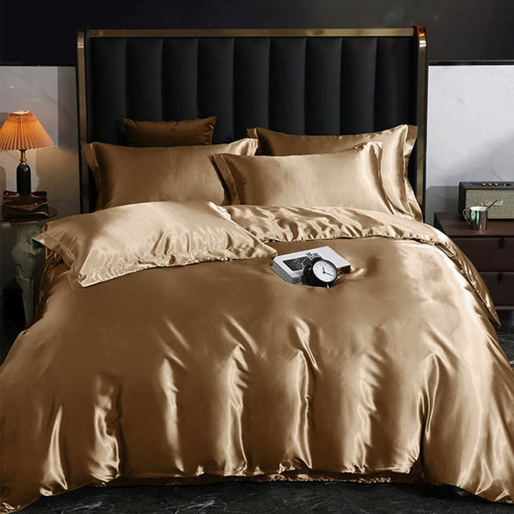 Luxurious smooth satin bed sheet set in elegant silver, perfect for a modern bedroom decor.