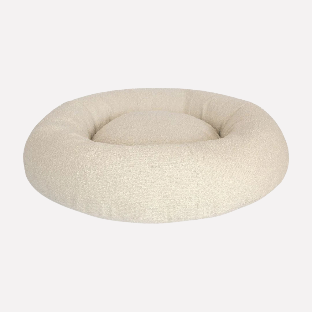 Luxurious unisex forest green pet bed with washable boucle fabric cover, ideal for dogs & cats.