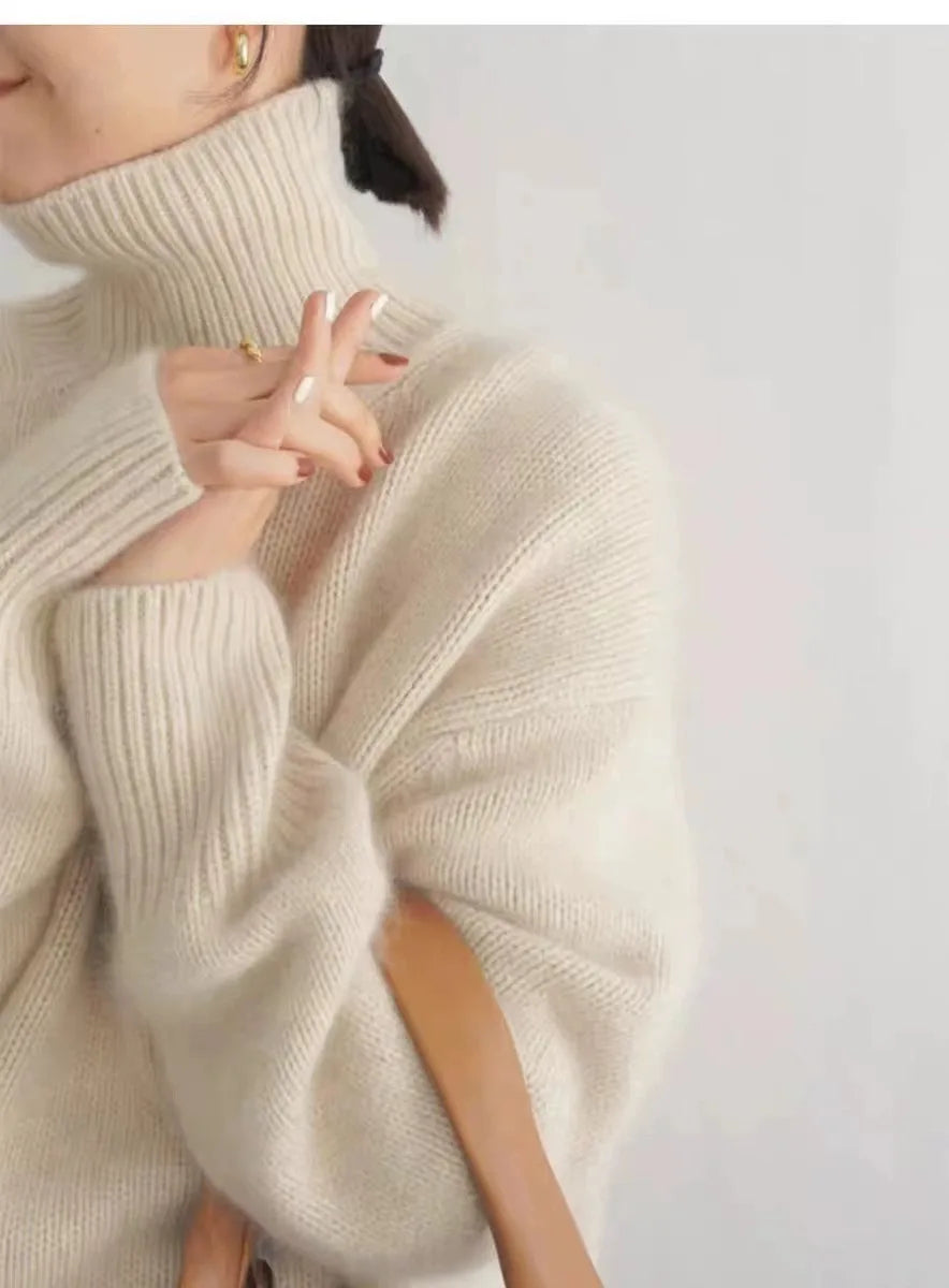 Cozy women's winter sweater with a warm turtleneck. Relaxed fit for ultimate comfort and style.