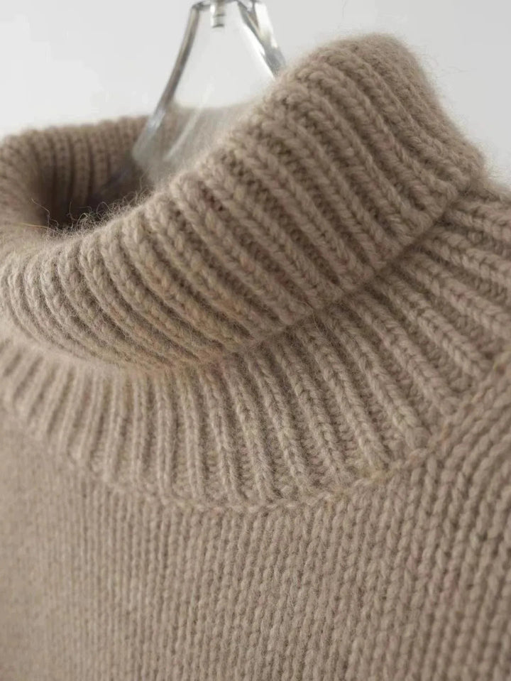 Comfortable women's fall sweater with a warm turtleneck. Stylish and versatile for any occasion.