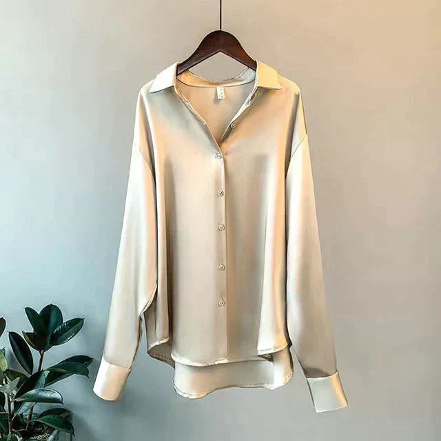 Luxurious women's relaxed fit blouse, elegant long sleeve top with button-front for sophisticated wear.