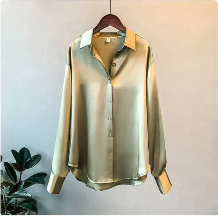 Close-up of a comfortable, chic women's blouse; elegant relaxed fit shirt with luxurious fabric detail.