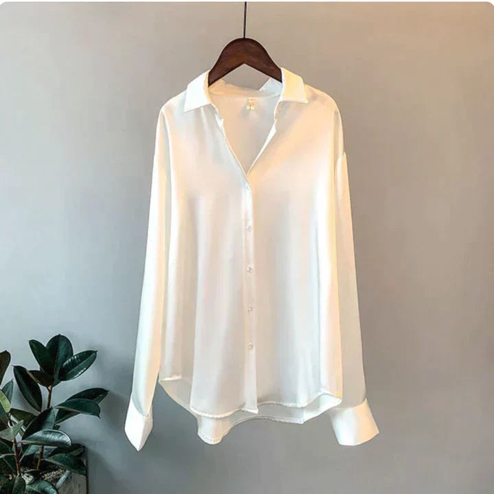 Versatile women's long sleeve blouse in a relaxed fit; sophisticated, chic top for various fashion styles.