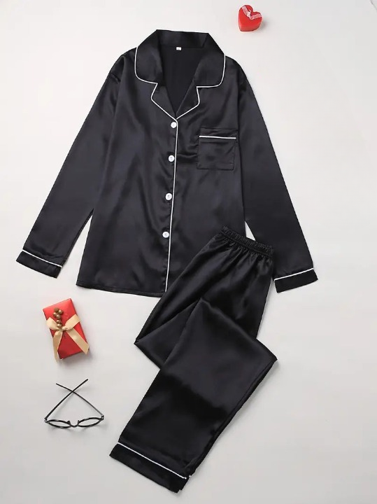 Women's comfortable silk sleepwear set, draped on a model, showcasing its flowy design & exquisite feel.
