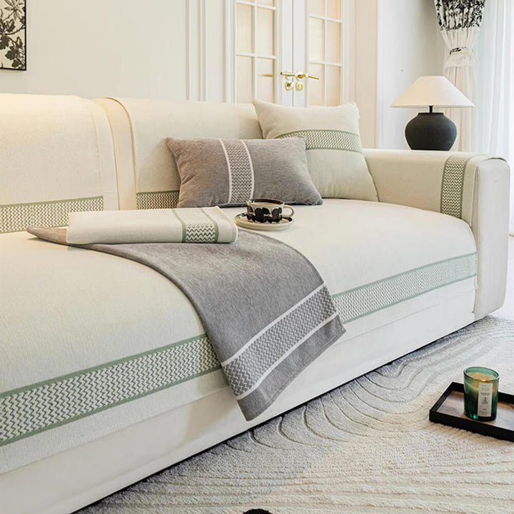 Close-up of chenille jacquard fabric texture, demonstrating scratch-resistant quality of sofa cover.
