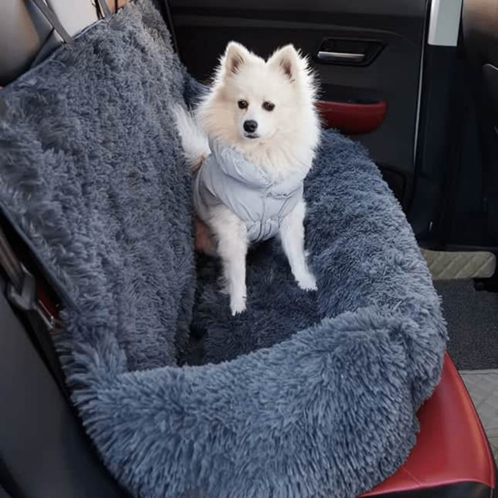 Dog car seat bed with safety straps, providing comfort and anxiety relief for pets during travel.