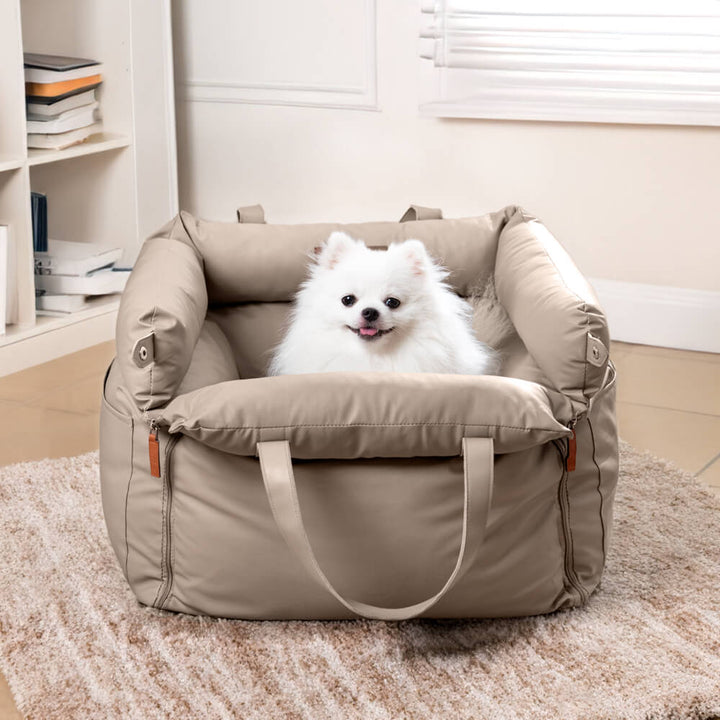Pet comfort booster, a stylish faux leather dog car seat for secure travel.