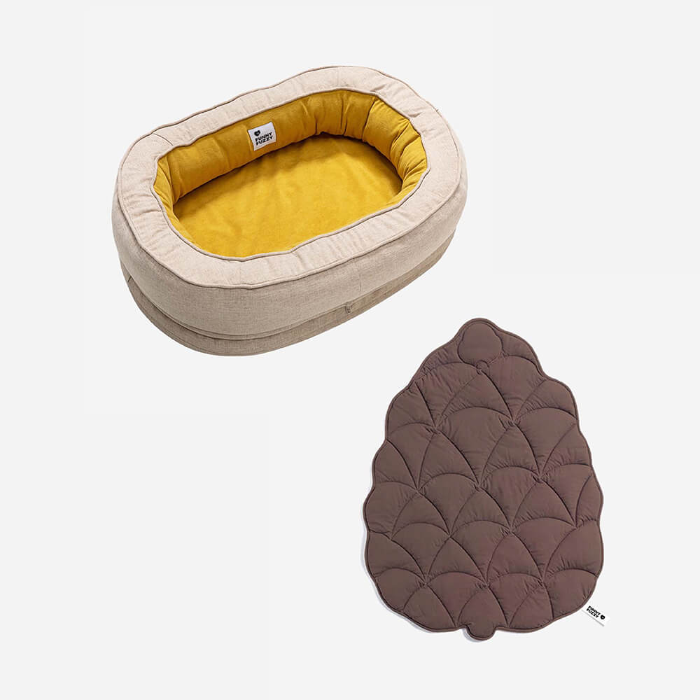 Donut dog bed with matching leaf blanket, ultimate relaxation.