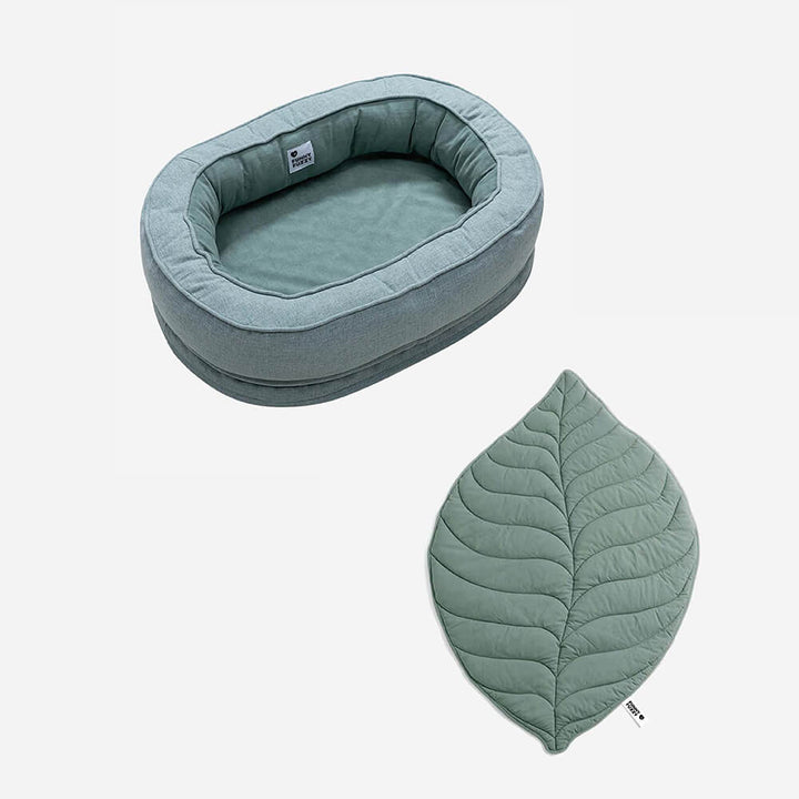 Soft washable leaf dog blanket and supportive donut bed.