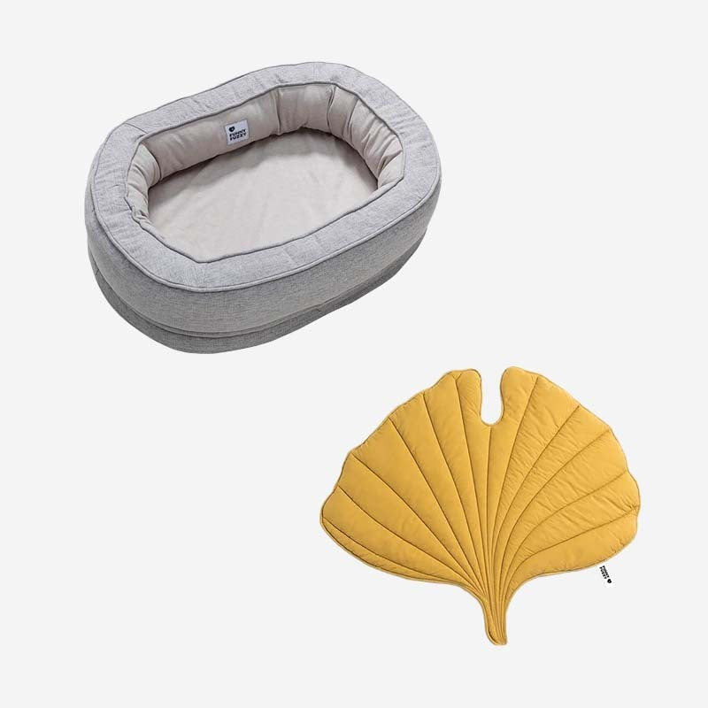 Designer leaf dog blanket paired with a cozy donut dog bed.