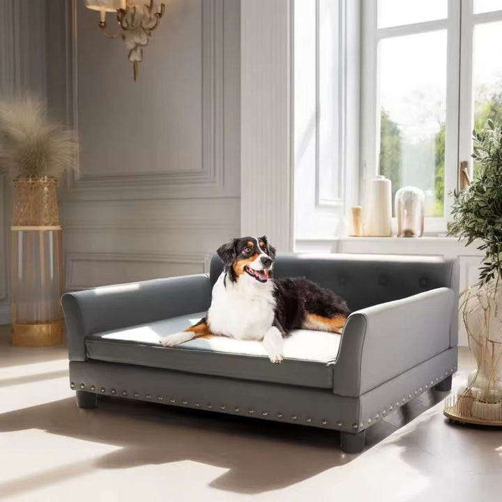 Elevated pet sofa lounger with distressed brown leather finish, designed for dog comfort and joint support.