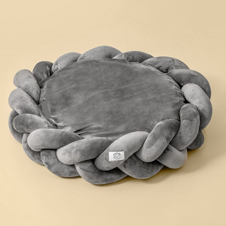 Detail of the zipper closure on the removable cover of a washable luxury dog bed.