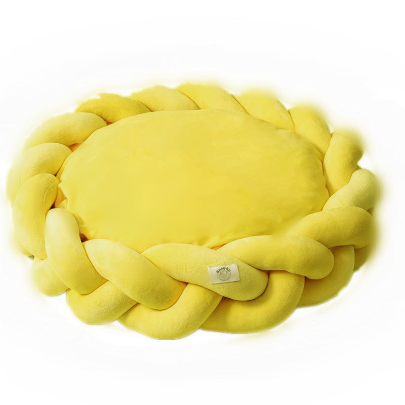 Small luxury calming dog bed, cream-colored, ideal for puppies or small breeds, removable cover.