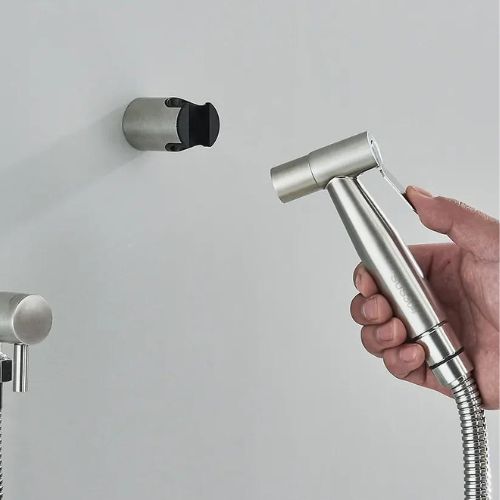 Unisex PureFlow bidet hand shower with adjustable pressure, perfect for enhanced personal bathroom hygiene.