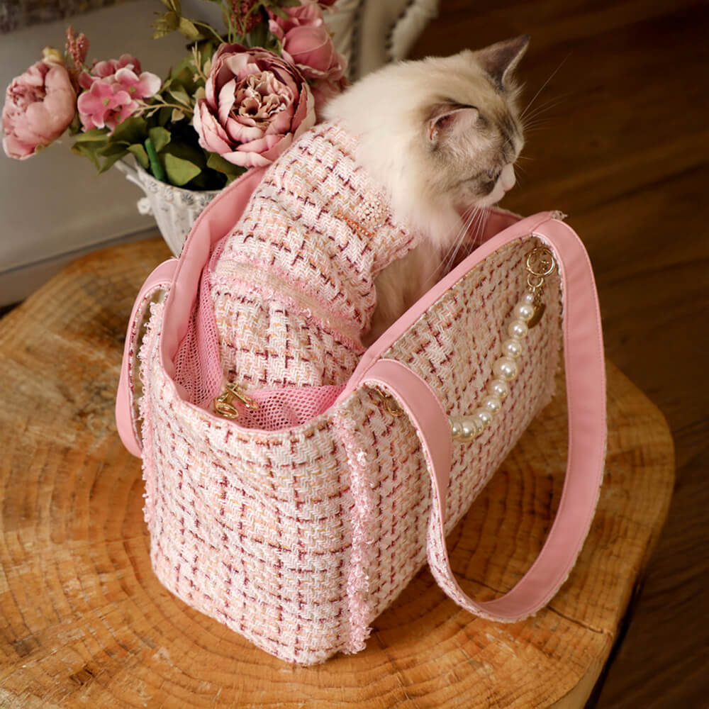 Comfortable luxury pet carrier in a classic tweed checkered pattern for discerning pet owners.