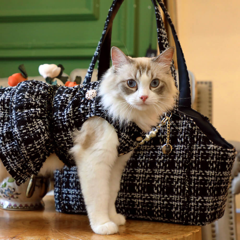 Secure and stylish: tweed checkered pet carrier bag providing comfort for your pet.