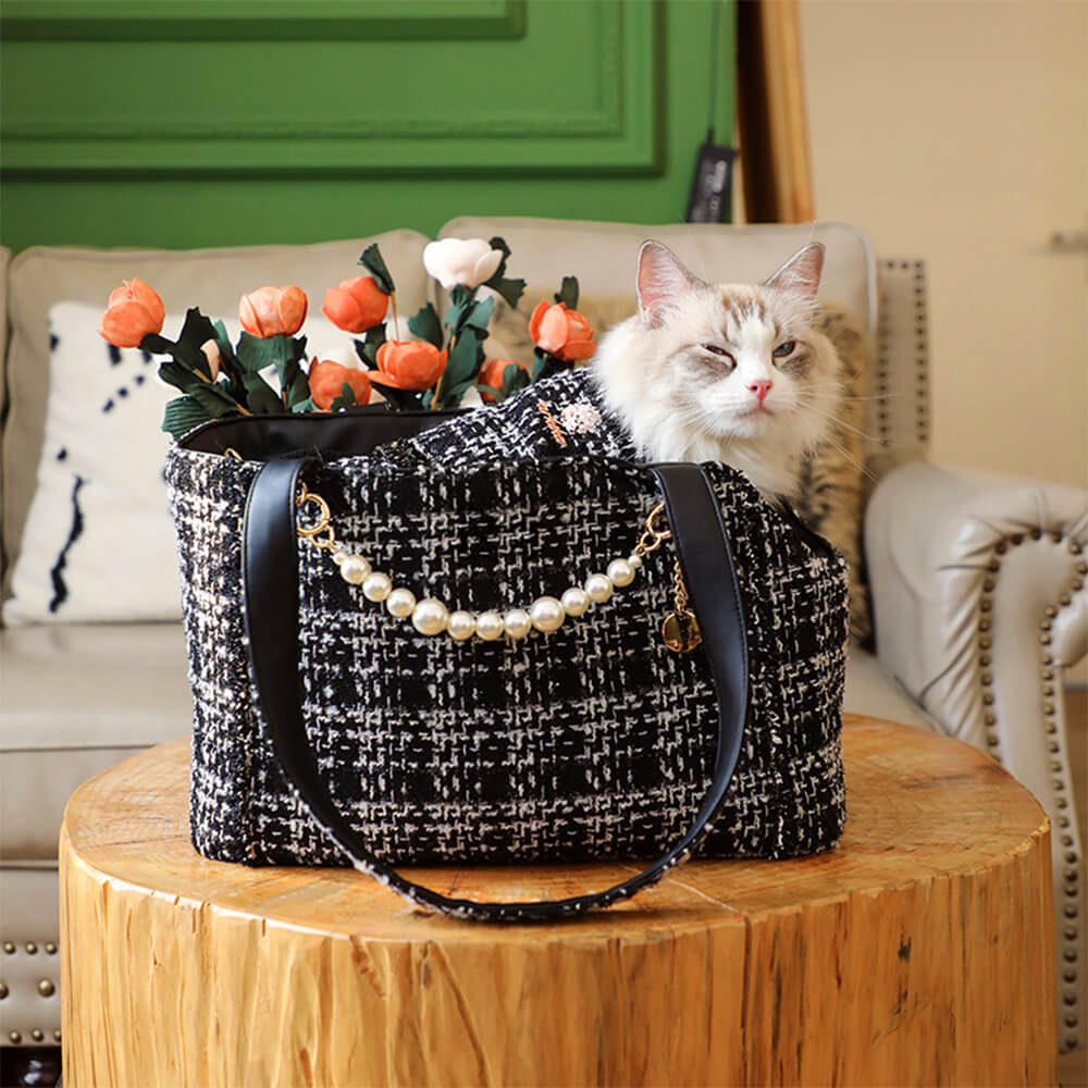 Premium tweed checkered pet carrier, blending luxury and practicality for dog or cat travel.