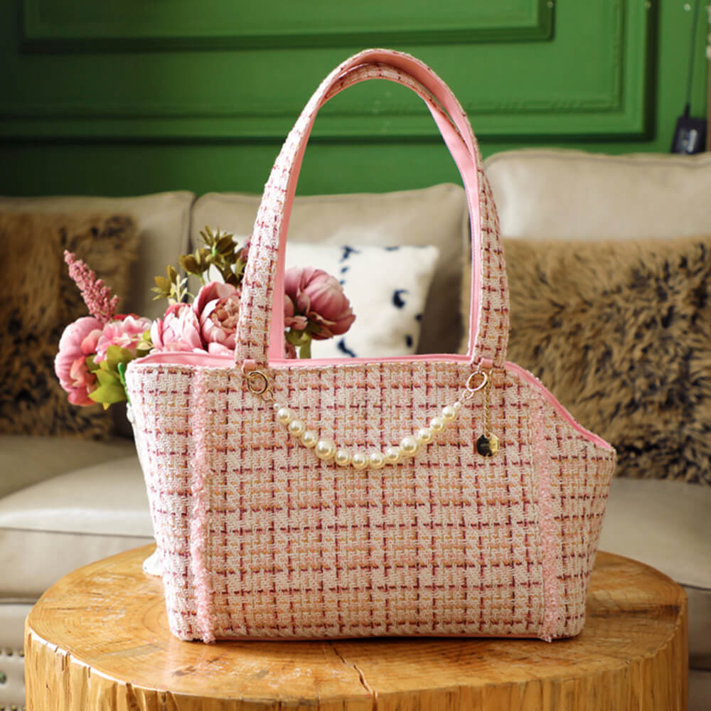 Stylish tweed pet carrier with checkered pattern, perfect for luxury cat travel and comfort.
