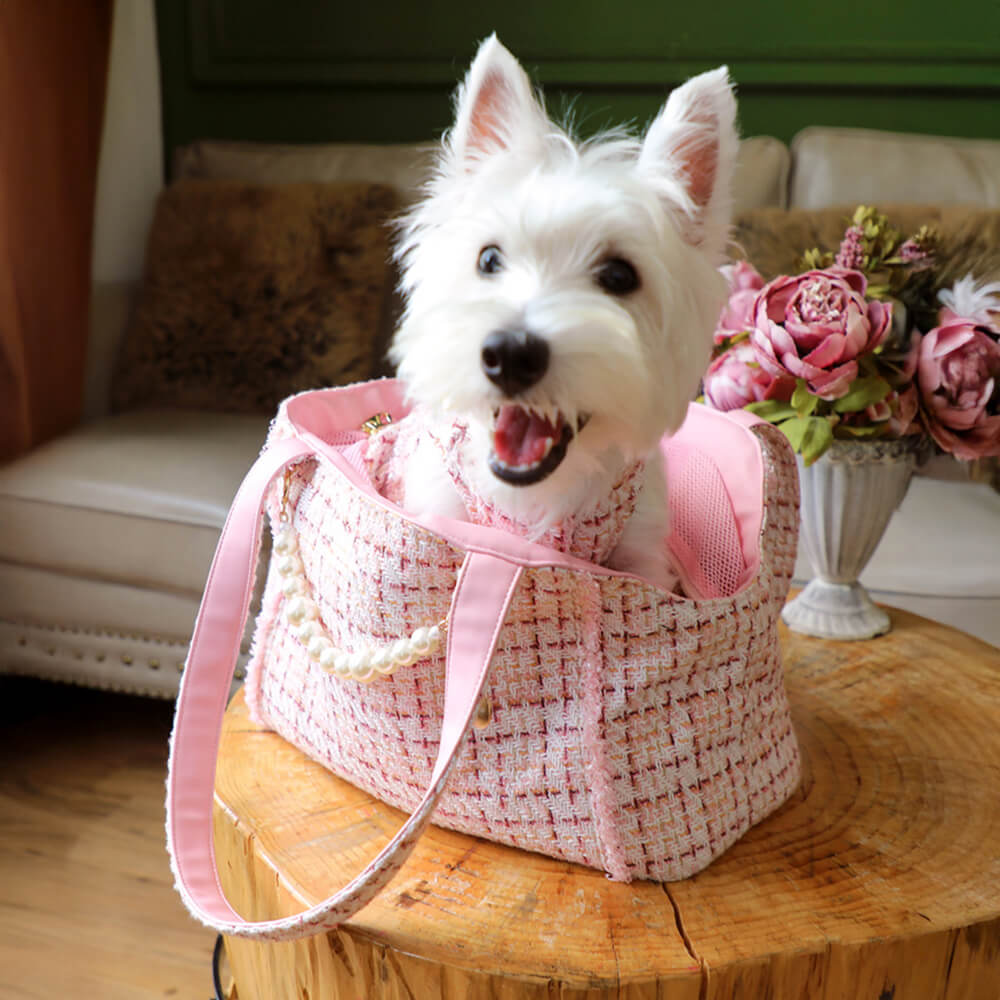 Elegant dog bag: luxury tweed checkered pet carrier for upscale pet travel experiences.