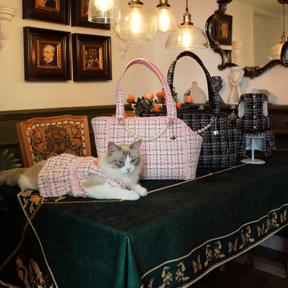 Portable pet carrier for small animals, tweed texture, stylish accessory for pet owners.