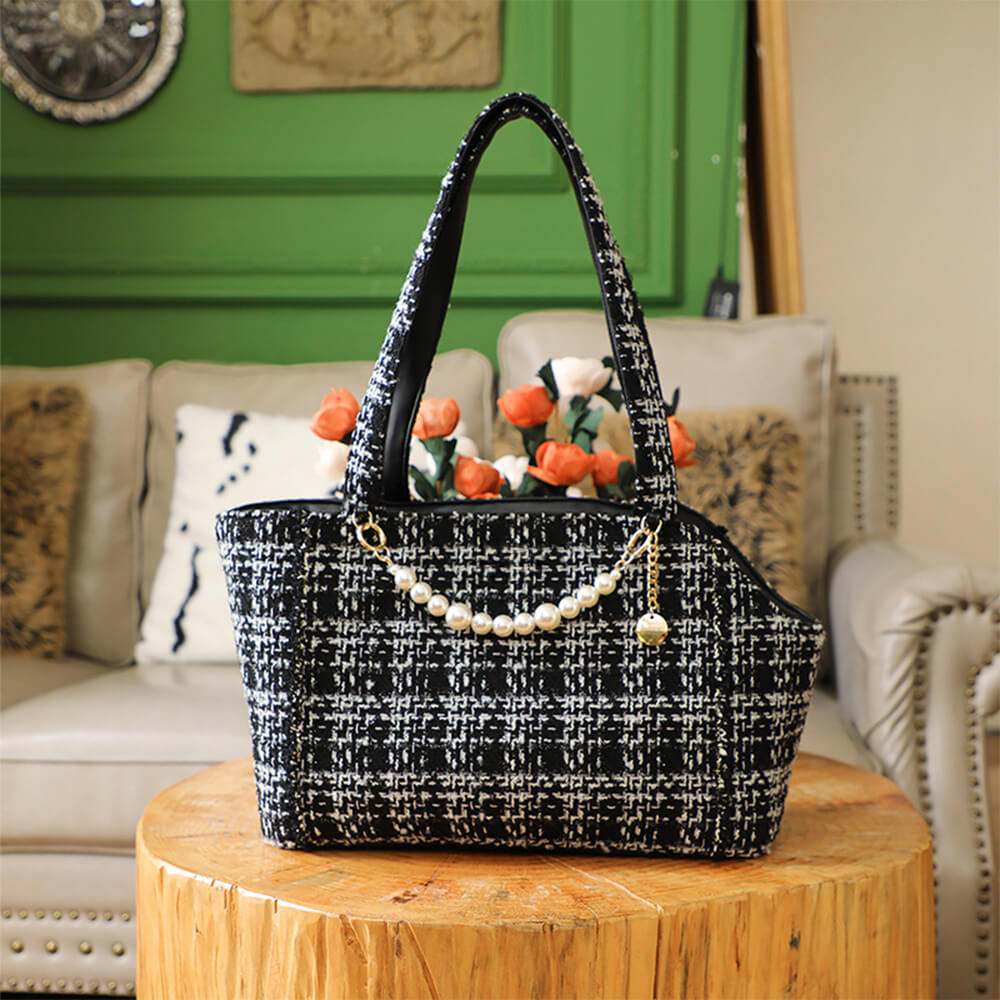 Portable luxury pet carrier for small dogs & cats, comfortable for travel, elegant tweed design.