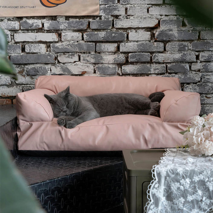 Waterproof dog sofa bed with plush supportive bolsters, ideal for luxury pet furniture, washable cover
