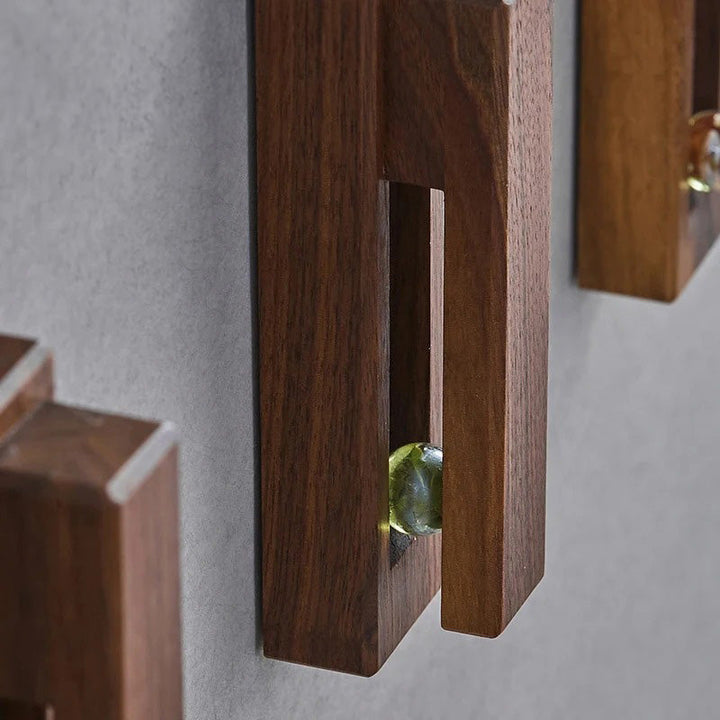 Versatile wooden wall hook, natural beech, for towels in bathrooms or kitchen. Simple adhesive installation.