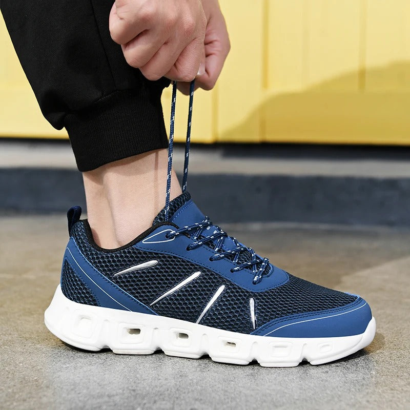 Ergonomic gray unisex running shoes, lightweight and supportive, ensuring ultimate comfort for any athletic activity.
