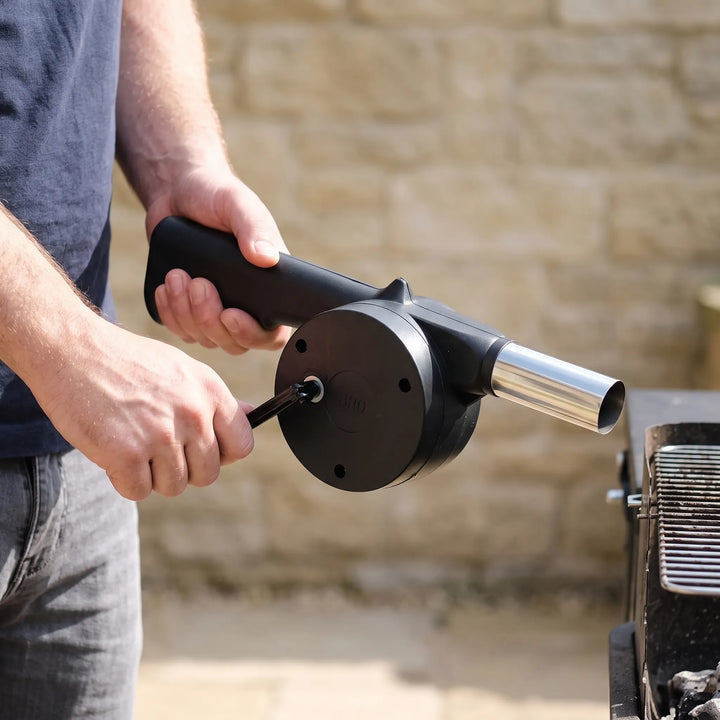 Manual BBQ fan for quick charcoal ignition, ideal for outdoor grills, camping, picnics. Hand crank blower.