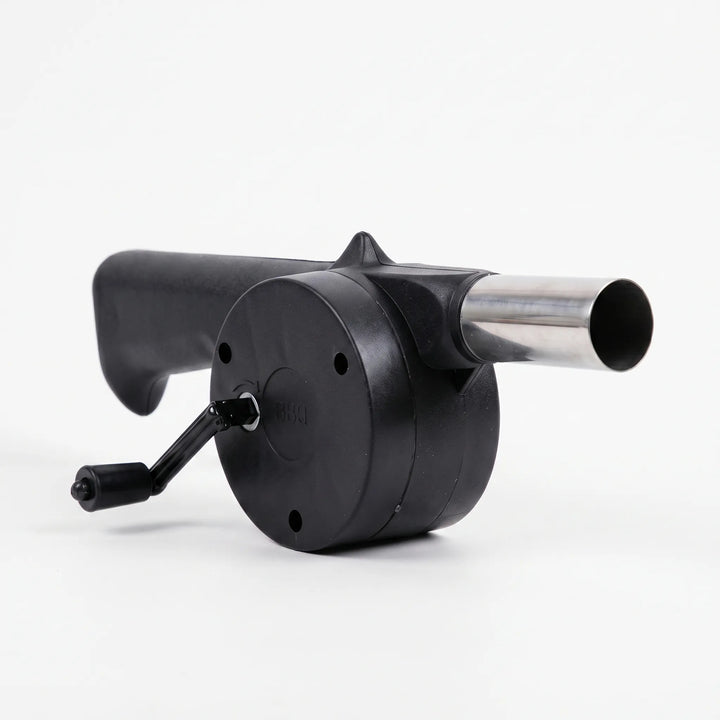 Efficient manual charcoal starter fan with hand crank, essential BBQ tool for quick fire ignition outdoors.