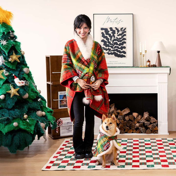 The reversibility feature of the plaid poncho shown on a dog, versatile pet apparel.