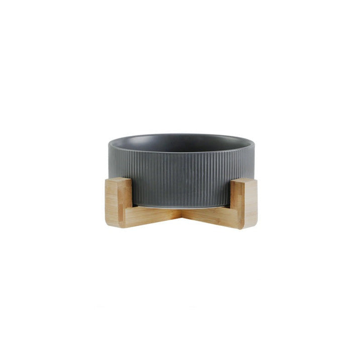 Pet food and water bowls, elevated on a wooden stand, promoting better posture for pets.