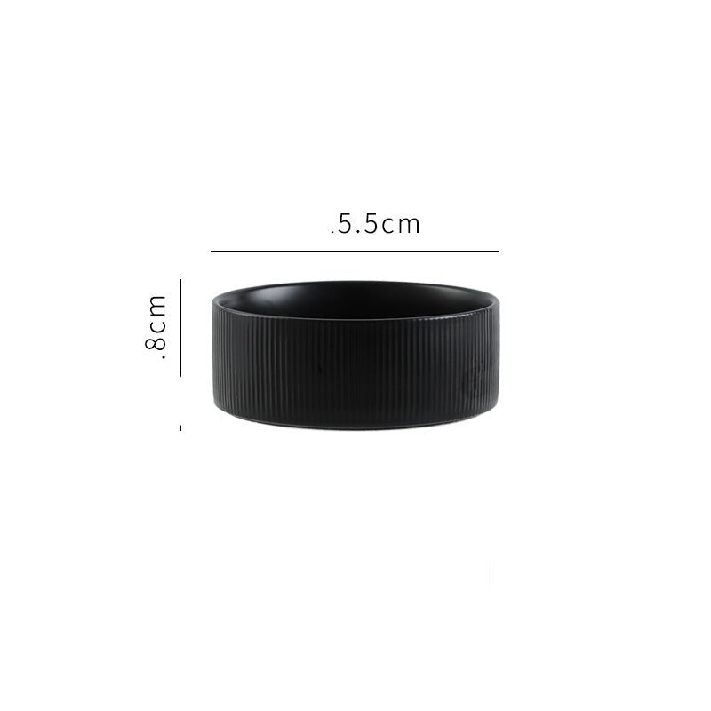 Corner view of the matt black pet bowls in a wooden stand, fitting seamlessly into home decor.