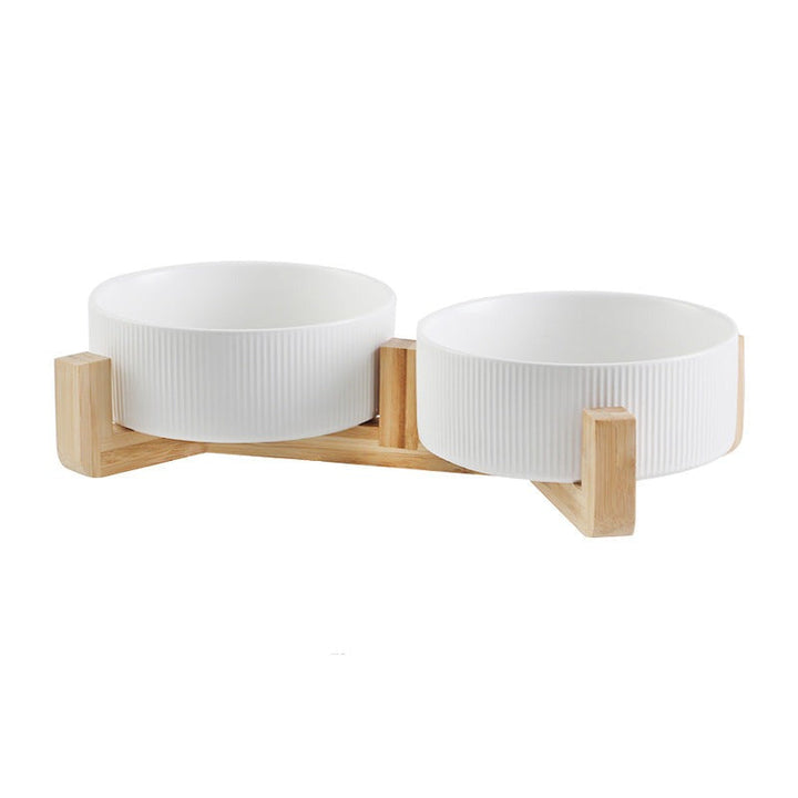 Ergonomic pet feeding bowls with an elevated wooden stand, suitable for dogs and cats.