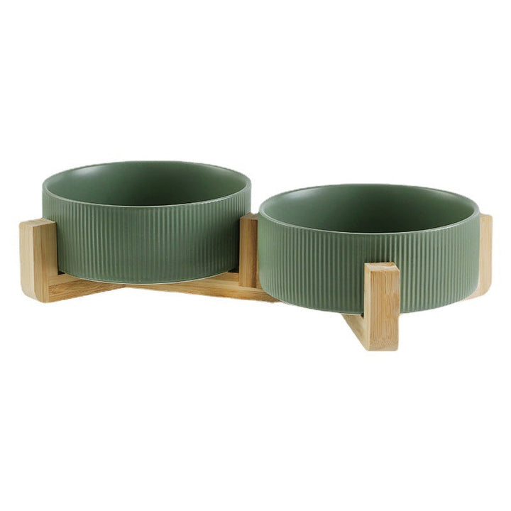 Side view of the pet feeding bowl set, highlighting the sturdy wooden stand and ceramic bowls.