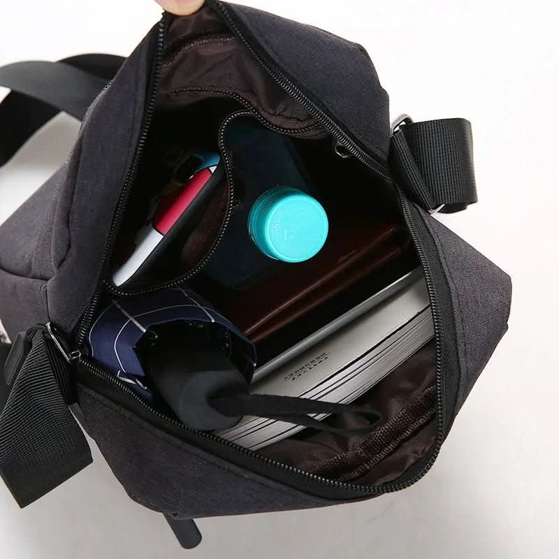 Durable men's anti-theft waterproof shoulder bag. Secure cross-body travel accessory to protect essentials from elements.