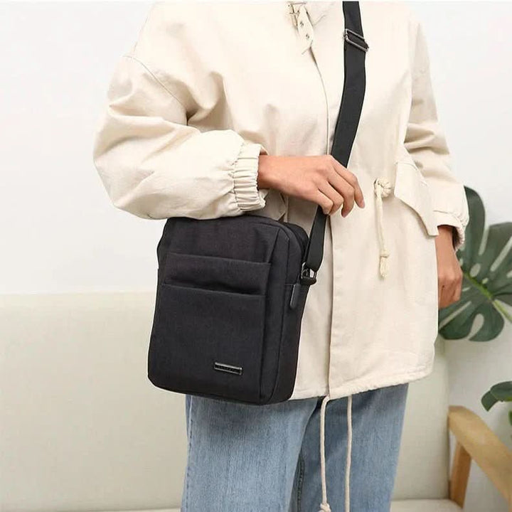 Stylish men's anti-theft shoulder bag. Waterproof cross-body travel accessory for modern men, secure & practical.