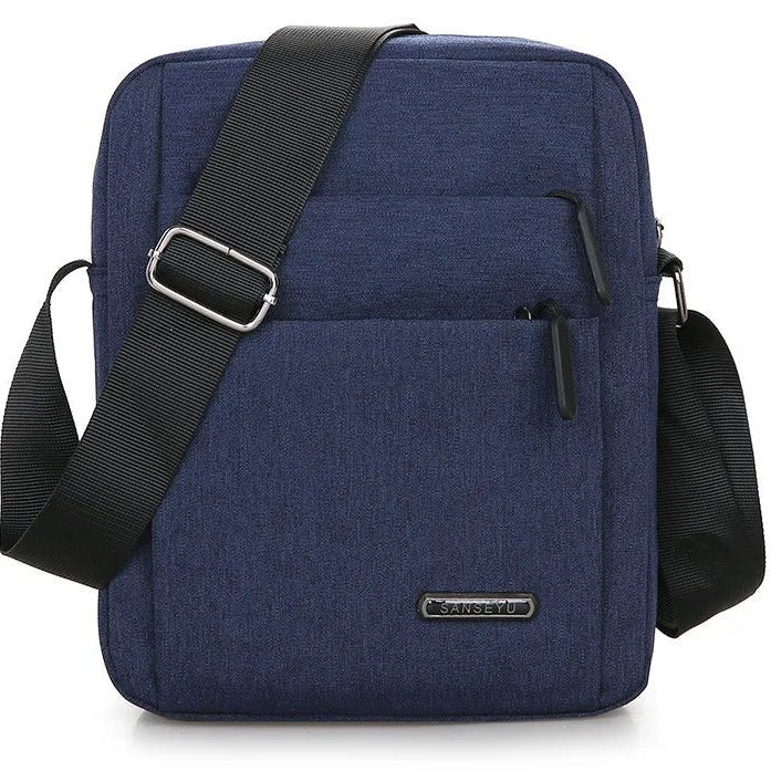 Side view of men's anti-theft waterproof cross-body bag. Durable and secure travel accessory with comfortable strap.