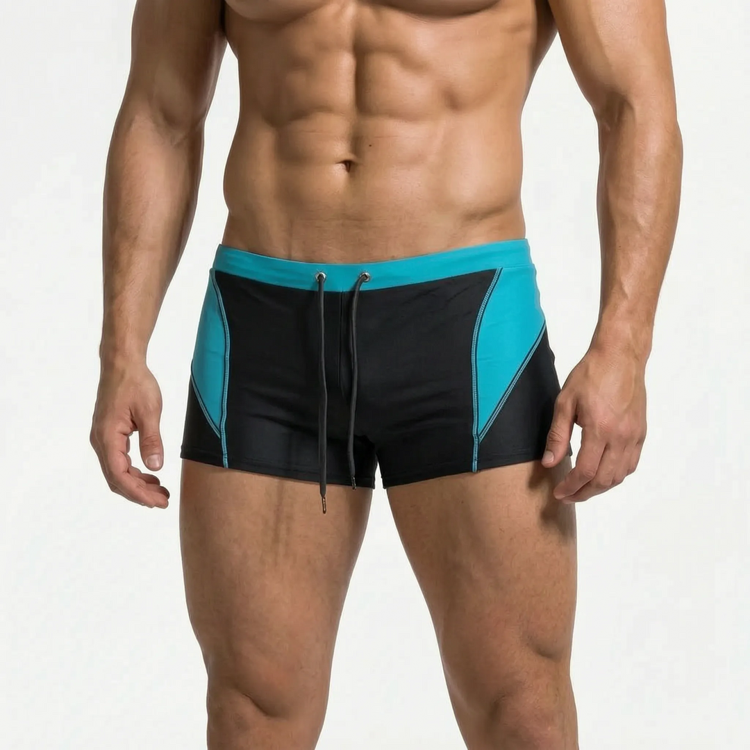 Men's quick-dry athletic swim trunks, color-block design for comfortable swimming & water adventures.